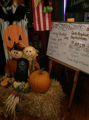 Cute Halloween display near the specials board.