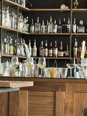 Dirty Glassware stacked on the bar where they make their drinks. Gross!!