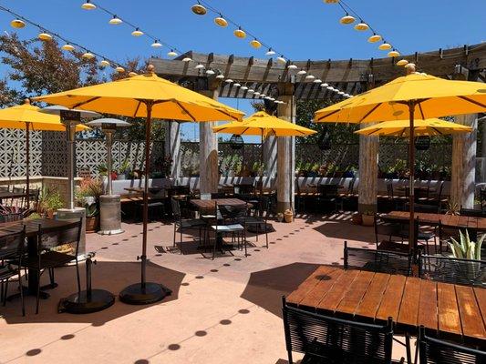 Our updated patio features safely spaced tables, booths with safety partitions and heat lamps.