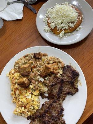 Calentado completo con carne asada - perico-style eggs, mixed rice & beans, flap steak, and a sweet corn arepa with crumbled white cheese