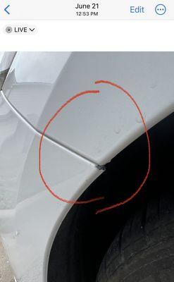 Paint chip on edge of bumper above right tire that wasn't corrected.