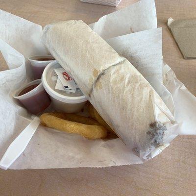 Philadelphia steak sub with onion rings and coleslaw