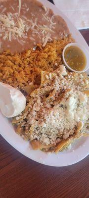 Green chilaquiles with rice and beans.