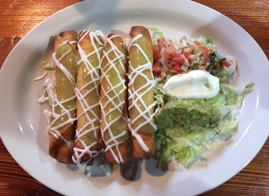 Flautas with sour cream and guacamole.