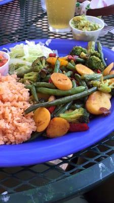 Veggie fajitas with yellow carrots and green beans.