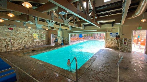 The indoor part of the pool. They have a roller door that closes down and separates the outside from the inside for the winter.