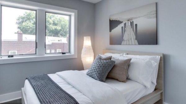 Staged guest bedroom featuring calming color scheme of grey, beige and white.  Location Washington, DC