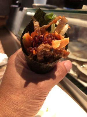 Salmon skin hand roll.  Crispy and delicious