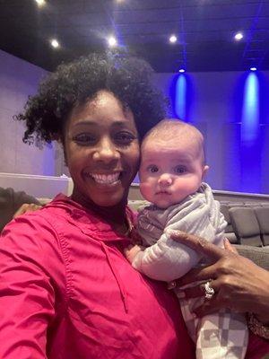 Holding a baby in harvest church