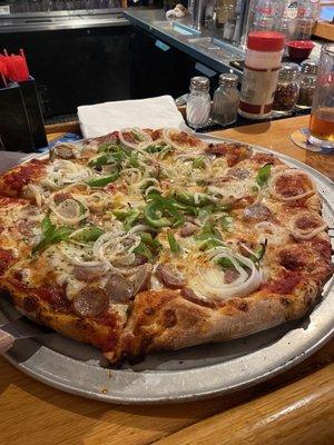 Large cheese pizza with sausage, peppers, onions and garlic