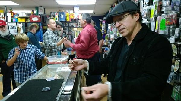 Magician Robb Fischer works the coins behind the counter!