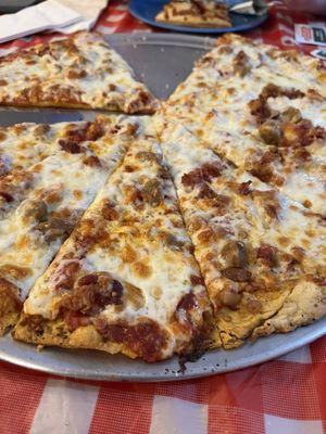 Thin crust light sauce meat lovers pizza