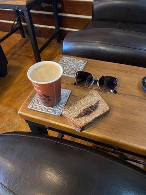 Dirty chai with oat milk + gf banana bread with cinnamon smile