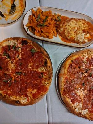 Sopressata and hot honey pizza, mortadella and pistachio pizza, and the chicken Parm Bronx style.