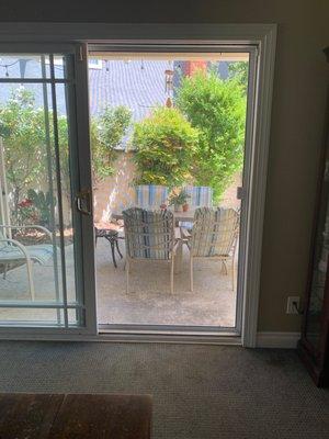 Excellent work in taking out and placing in a custom made screen door that glides smoothly.