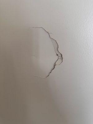 Hole in wall. Maintenance said "we know you didn't do that so we aren't going to charge you for it." And he left.