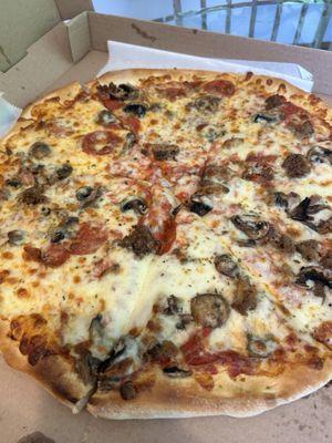 Large pizza with mushrooms, pepperoni and sausage