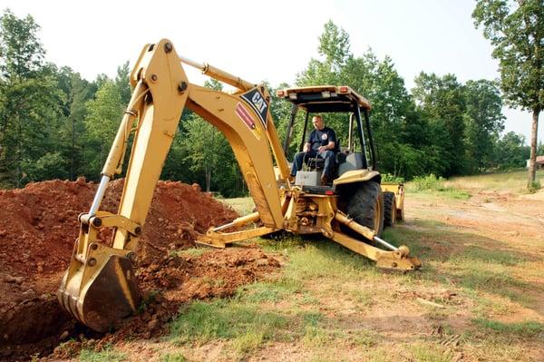 Backhoe trenching for sewer & water line installation & repair