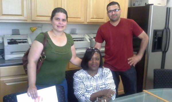 Our Seller and Buyer Clients, Gurselle and Domingo pose with Darlene after Closing.