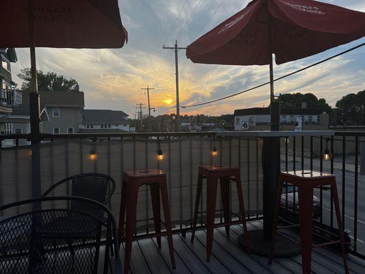 Rooftop seating and sunset