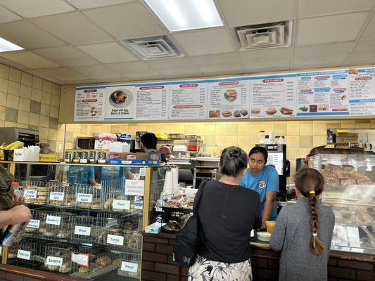 Inside, bagel display case and menu