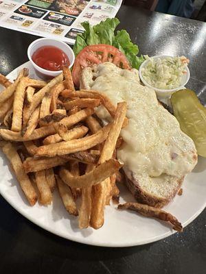 Tuna melt with fries.