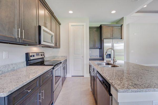 Grey cabinets and light countertops are the in thing these days.  :)