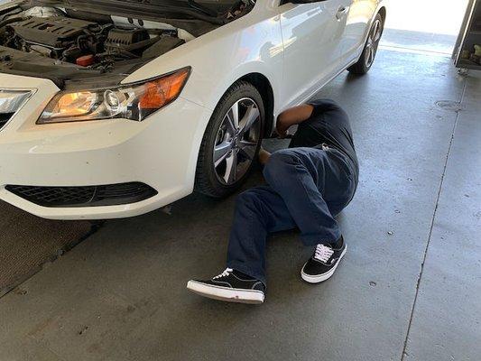 This is Angle servicing a car at the smog star station.