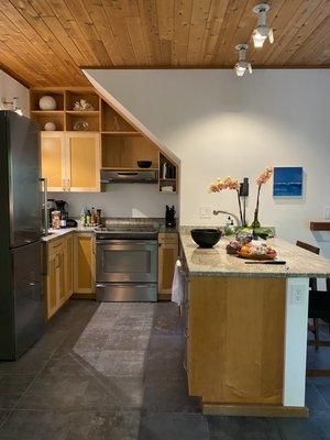 Chef's kitchen with welcome basket of goodies left on the kitchen island