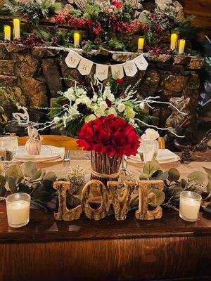 Sweetheart table in front of the fireplace