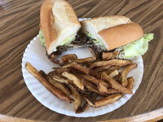 Steak and cheese sub with peppers and mushrooms