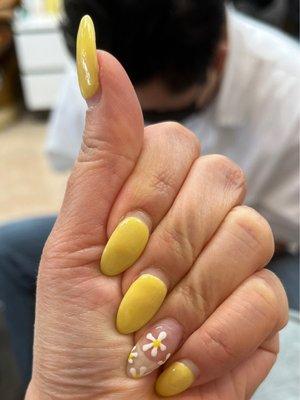 Dip powder over natural nails and a flower design. I think it was about $55 total.