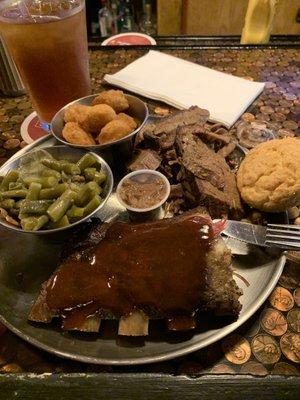 Two meat sampler with brisket, ribs, green beans and corn nuggets.