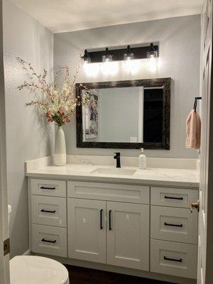 Bathroom update including cabinets, countertops and flooring