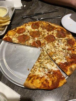 Pizza half pepperoni half cheese