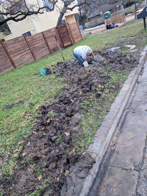 plumber fixing our water main after Splash drove a massive trailer through our yard. Splash was working on a site next door, not for us.