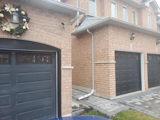 comparison of my garage door and the neighbour's garage door installed at the same time.