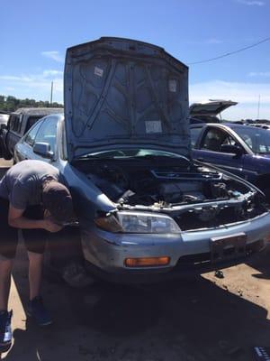 Gettin' that bumper off.