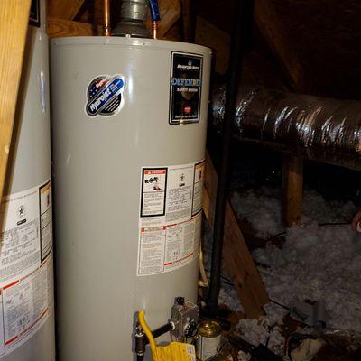 Double heater install on a 2nd floor attic on a hot Texas summer day.