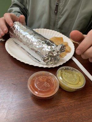 Burrito came w diff hot sauces red and green salsa verde & handful of chips.