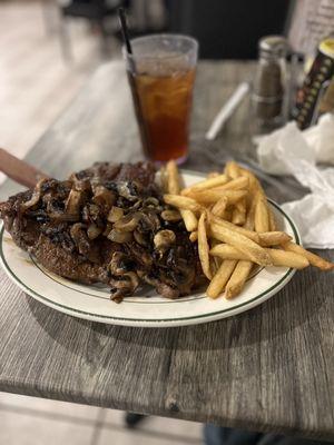 22-ounce porterhouse, sautéed mushrooms, and onions