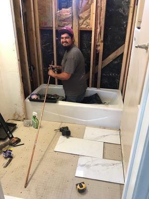 Bathroom remodel with a brand new tub install and a shower valve by Adam.