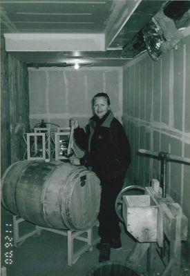 Winemaker Debbie Hansen in the year 2000 with her last barrel of homemade wine! Cougar Crest Estate Winery had its first vintage in 2001!