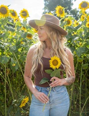 Summer sunflower photo of young woman.