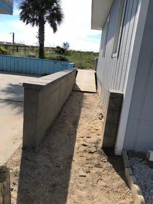 Masonry work done by Stones by Earth. Center block column and wall with stucco and caps.