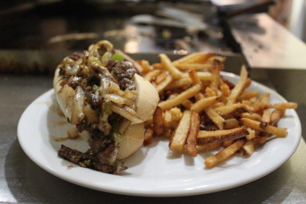 Traditional Cheesesteak with provolone cheese and fries