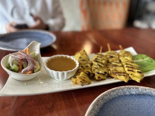 Chicken Satay..... nice amount of peanut sauce and cute little cucumber salad!