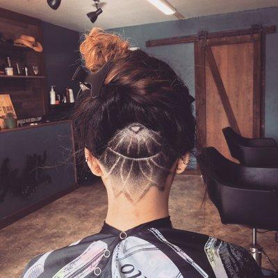 Women's undercut with design/graphics.