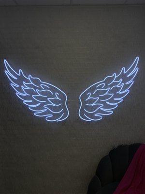 In trying room. Neon wings.