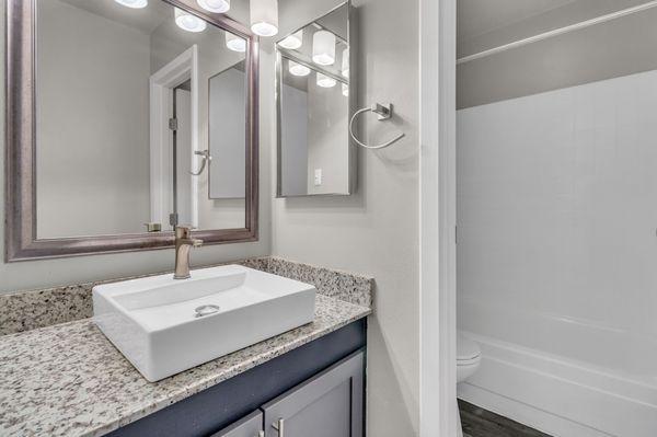 Full bathroom with tub shower.